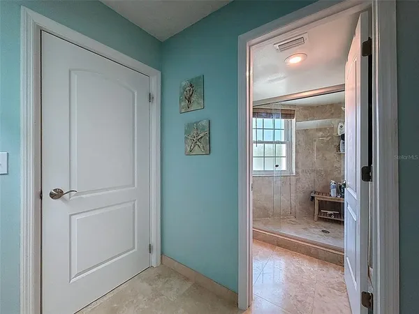 a view of a workspace with furniture and wooden floor
