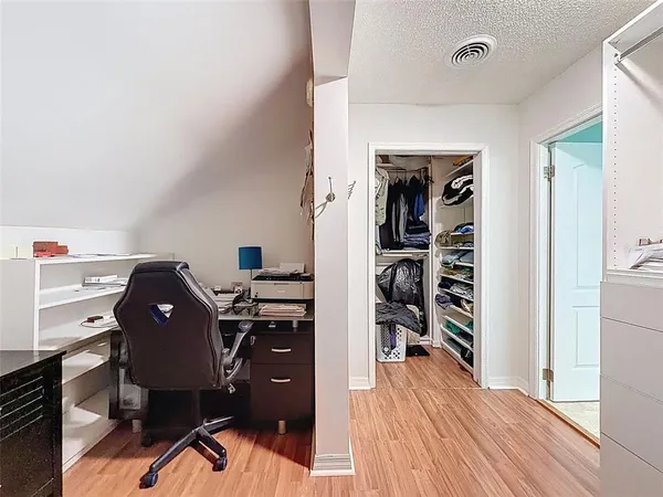 an aerial view of house with yard and ocean view