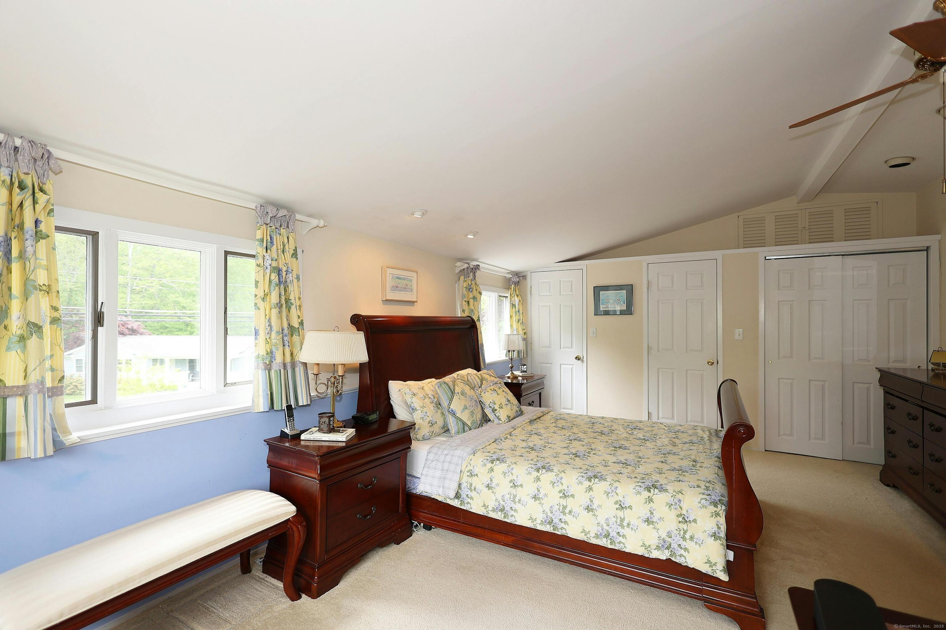 252 Florida Hill Road Ridgefield, CT 06877 - Photo 28 of 40 a bedroom with a bed and a couch