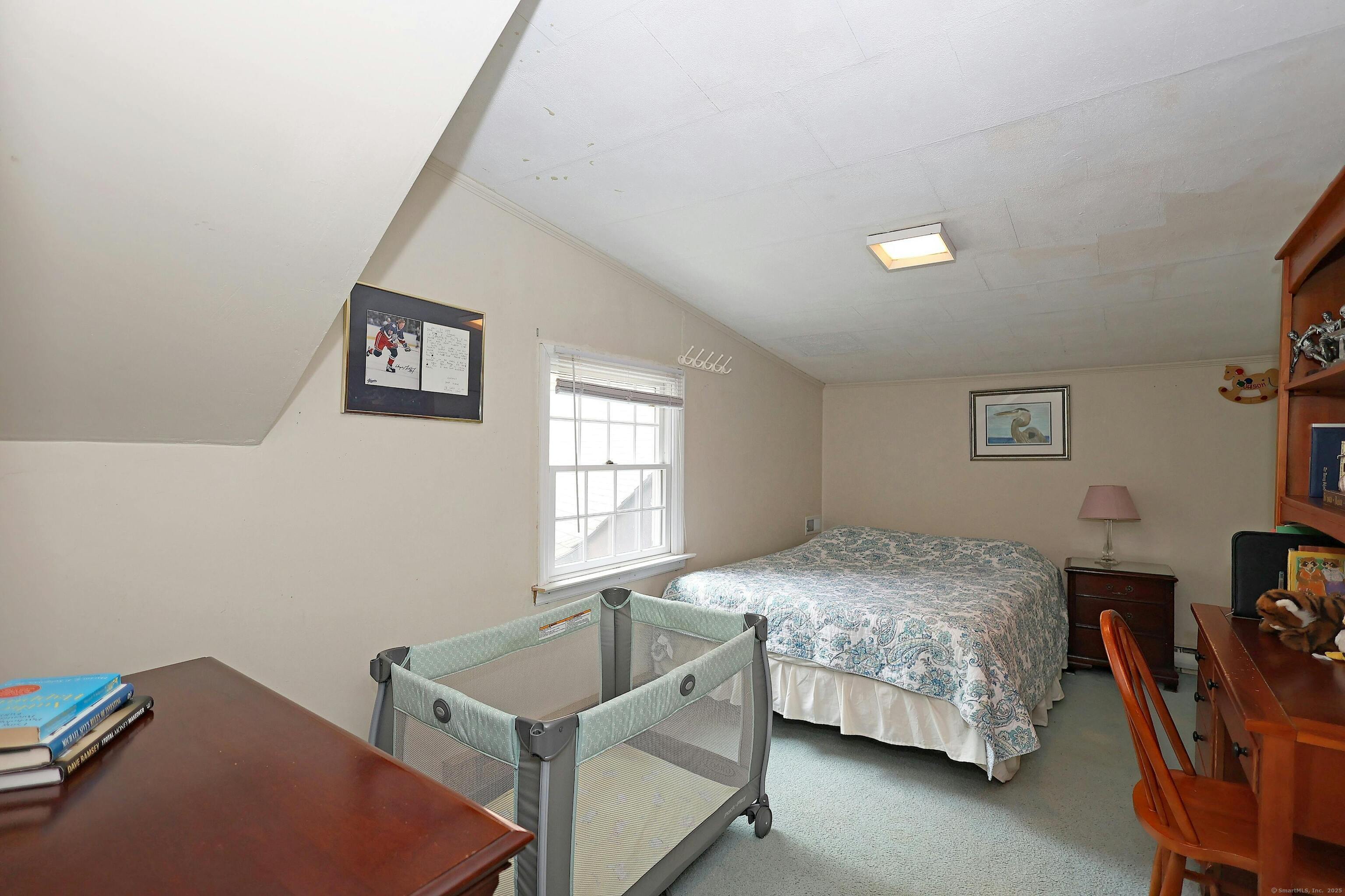 252 Florida Hill Road Ridgefield, CT 06877 - Photo 31 of 40 a bedroom with a bed and a table in it