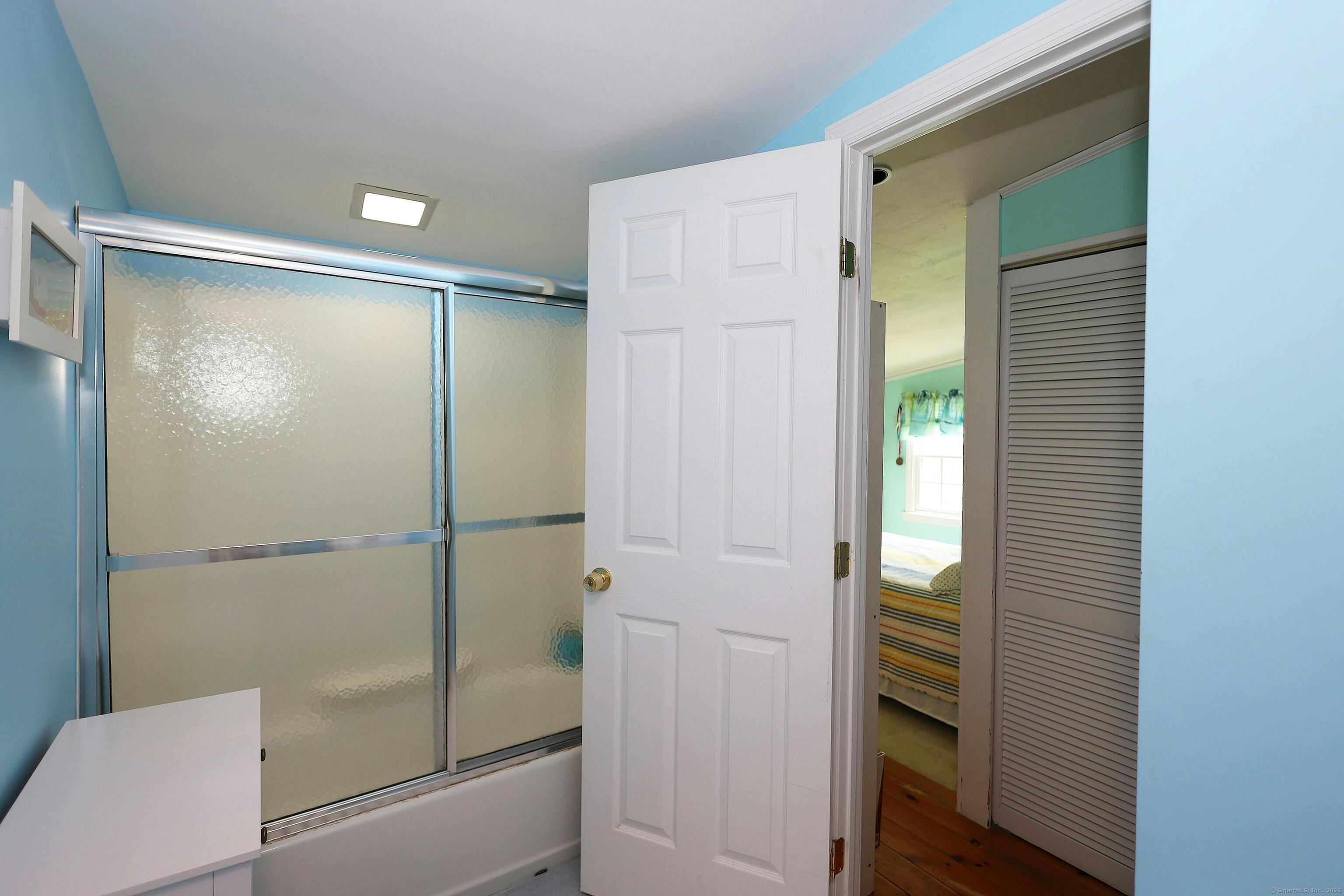 252 Florida Hill Road Ridgefield, CT 06877 - Photo 32 of 40 a bathroom with a shower and a glass door