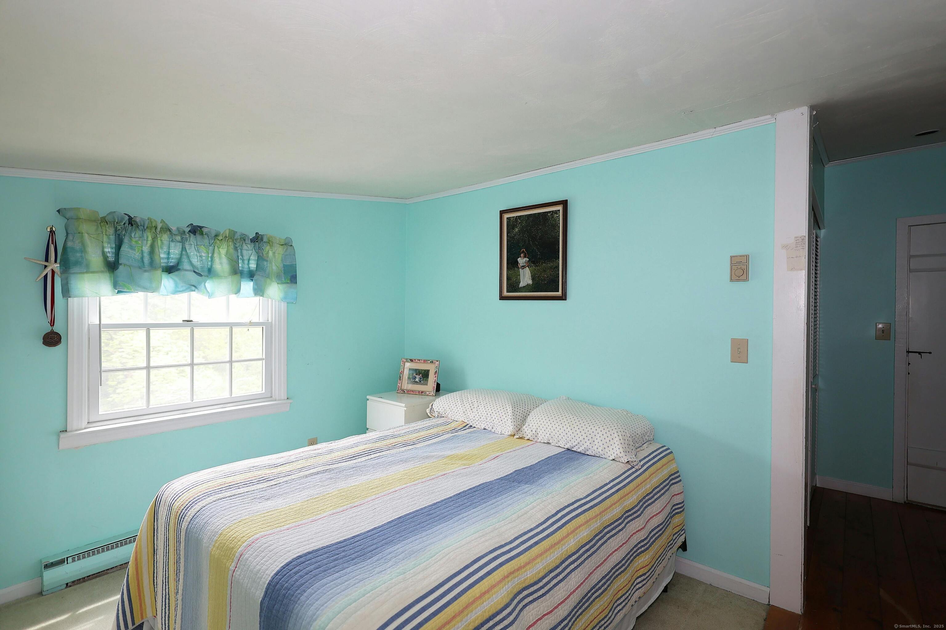 252 Florida Hill Road Ridgefield, CT 06877 - Photo 33 of 40 a bedroom with a bed and a window
