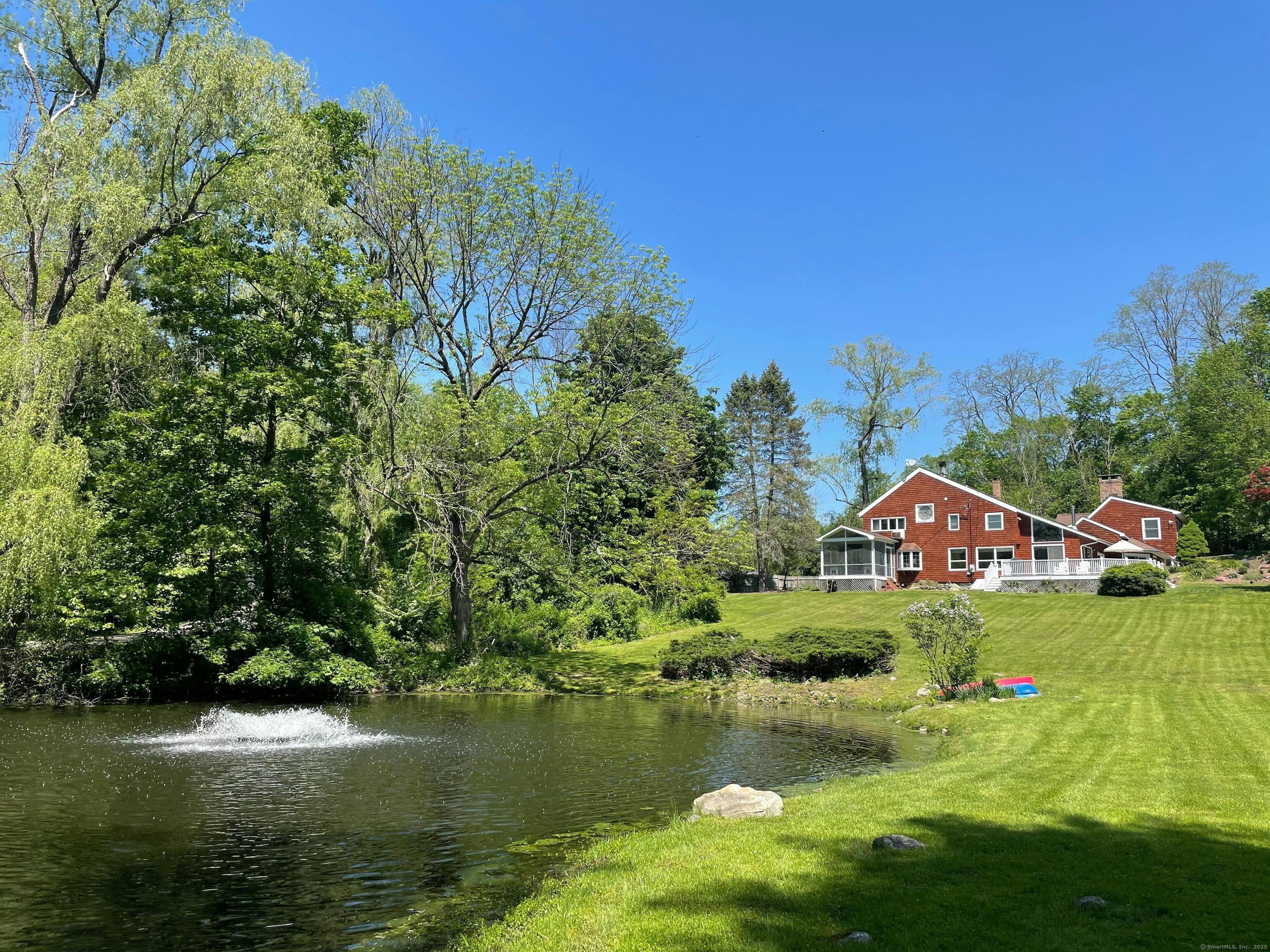 252 Florida Hill Road Ridgefield, CT 06877 - Photo 40 of 40 a view of a lake with houses in the background