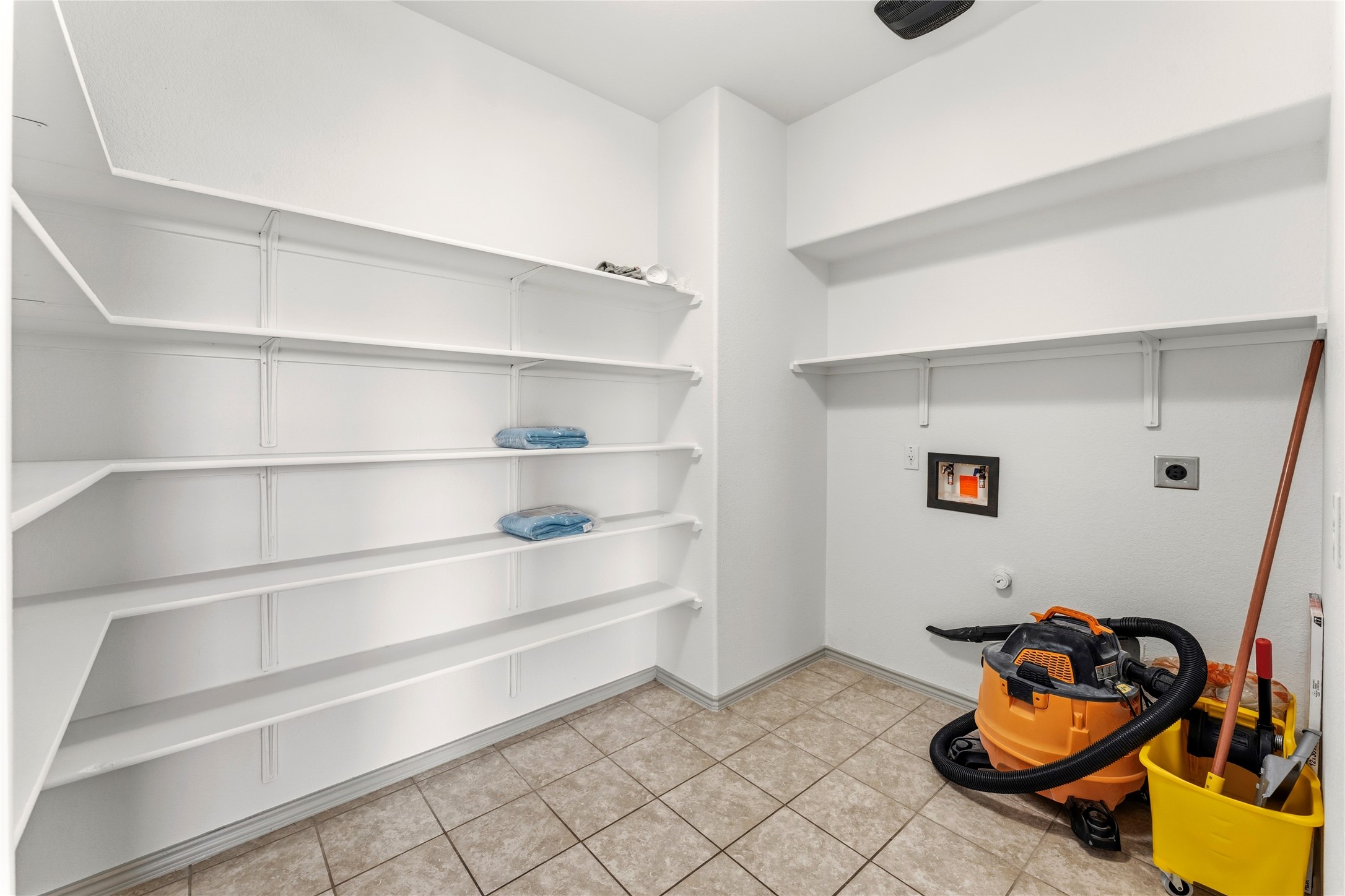 100 Serpentine Lane Jarrell, TX 76537 - Photo 16 of 40 a room with chair and closet
