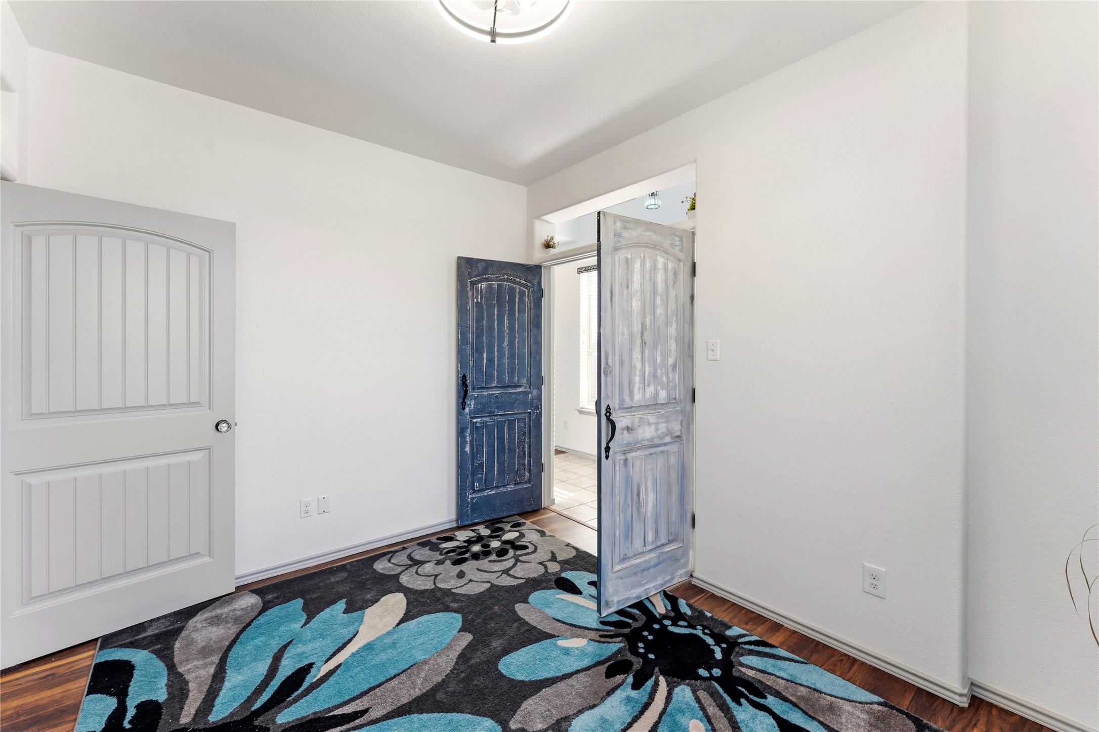 100 Serpentine Lane Jarrell, TX 76537 - Photo 18 of 40 a view of entryway with window and wooden floor