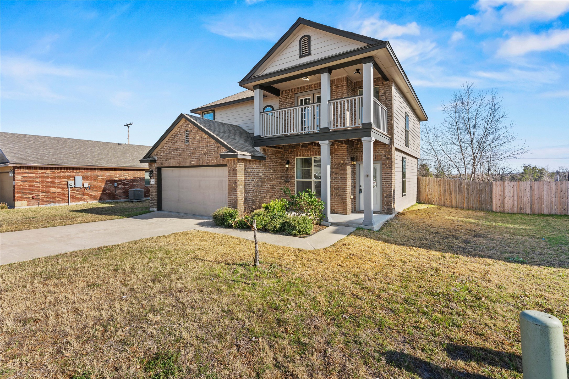 100 Serpentine Lane Jarrell, TX 76537 - Photo 2 of 40 a front view of a house with a yard