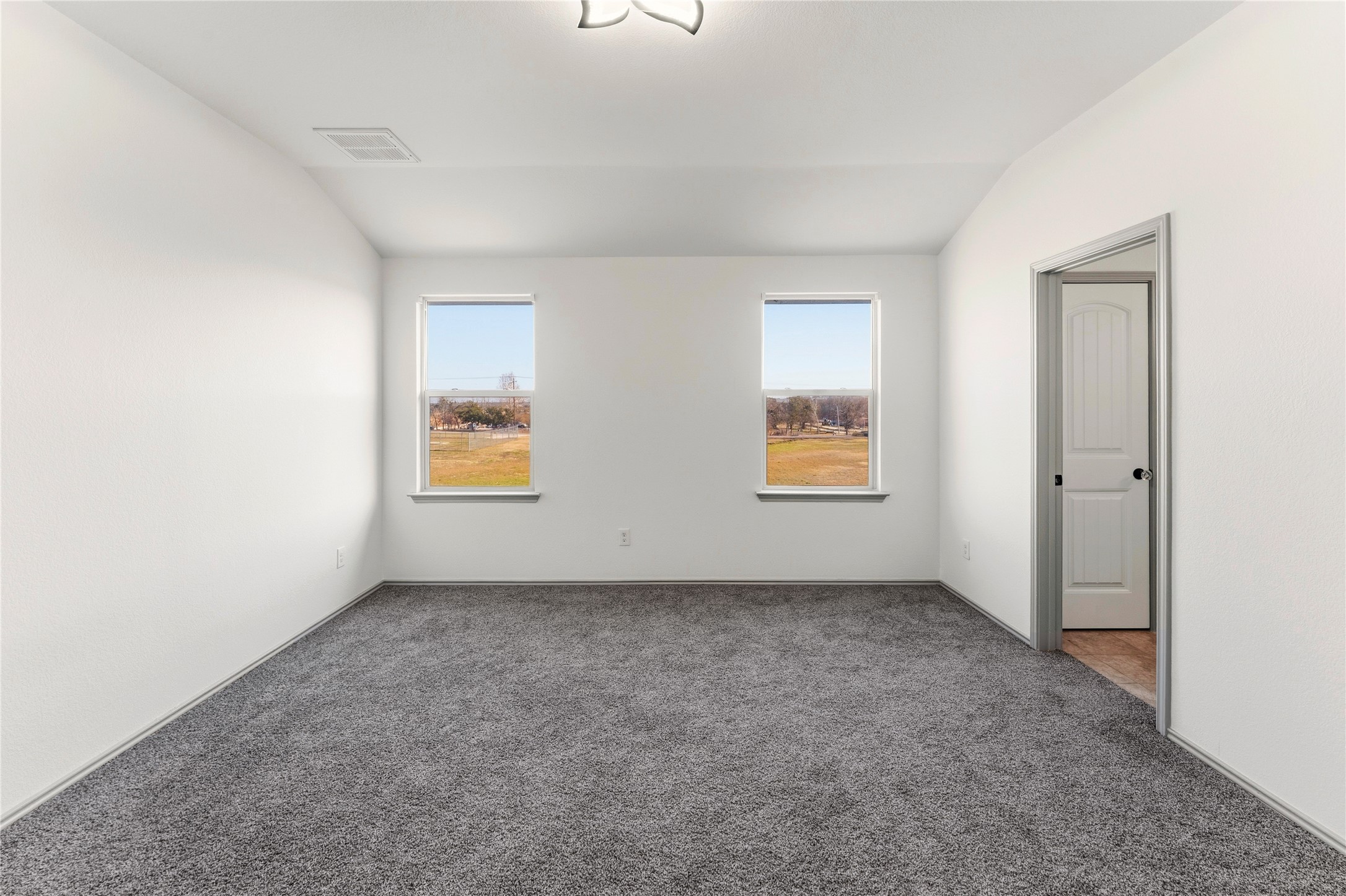 100 Serpentine Lane Jarrell, TX 76537 - Photo 26 of 40 an empty room with windows