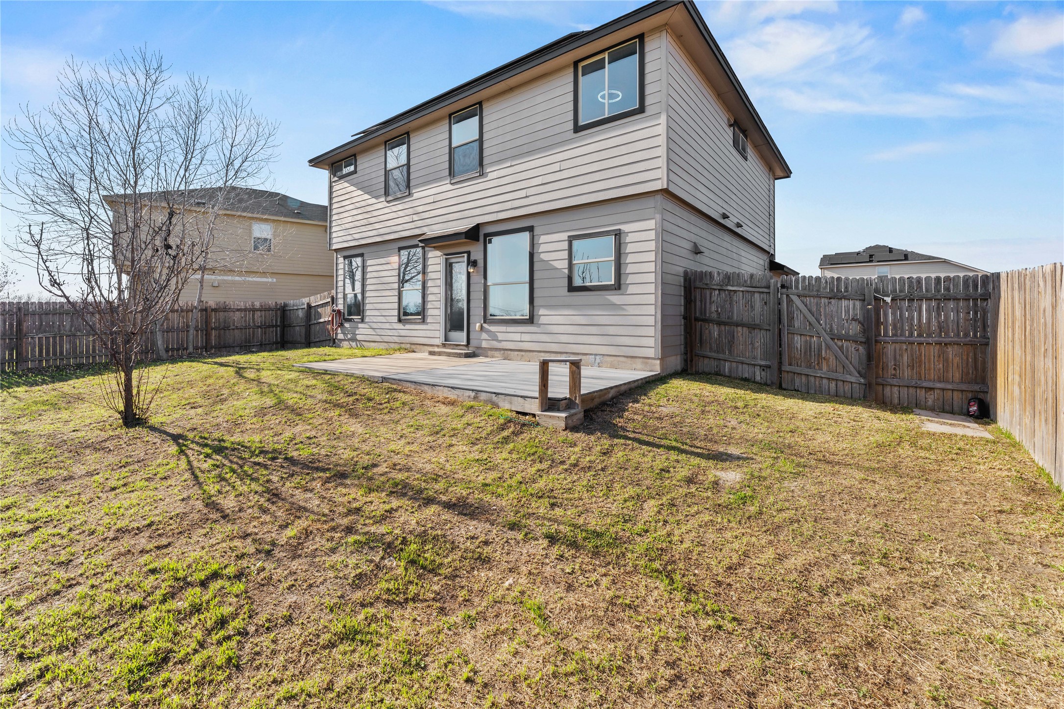 100 Serpentine Lane Jarrell, TX 76537 - Photo 39 of 40 a view of a house with a yard and wooden fence