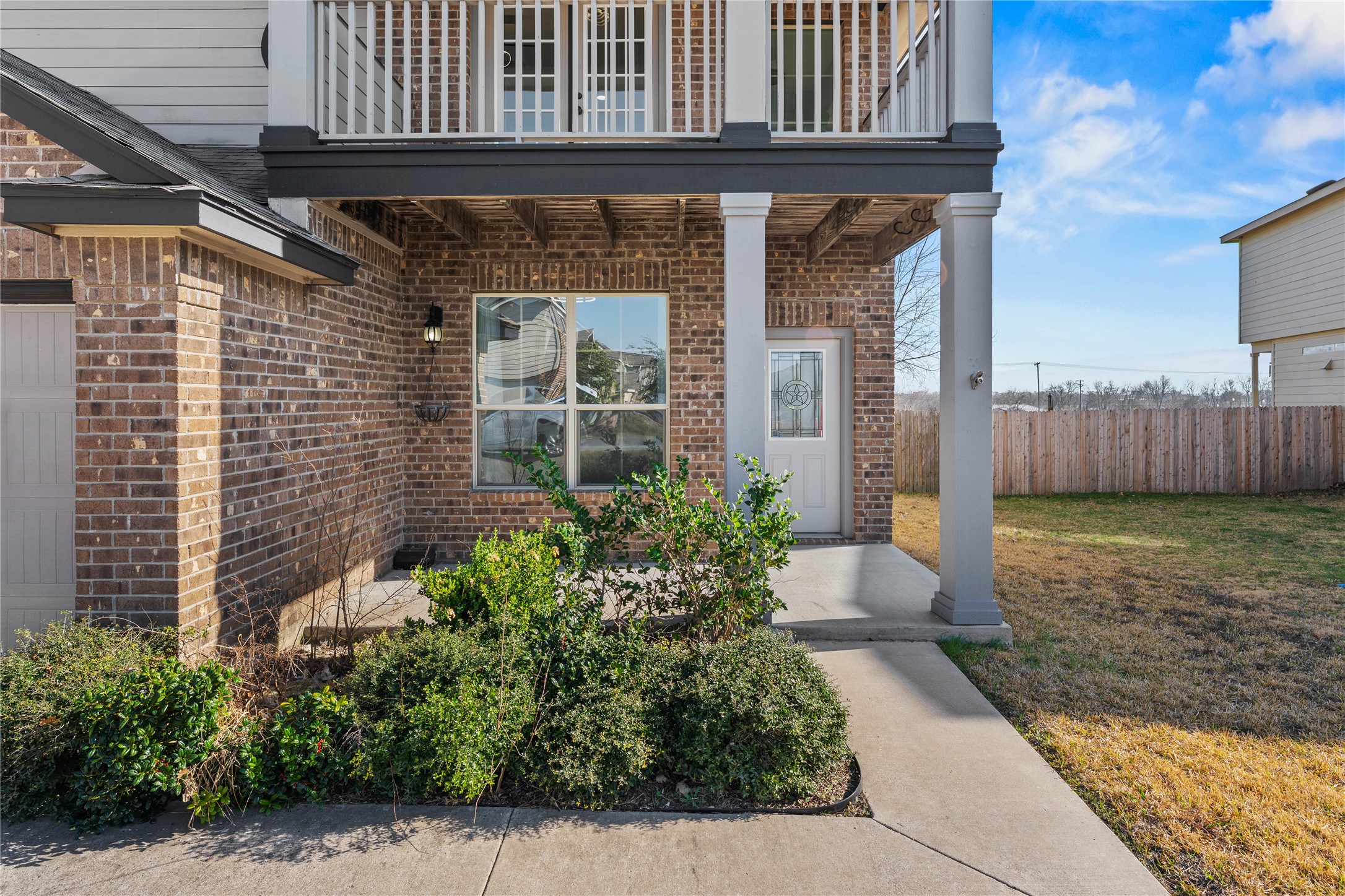 100 Serpentine Lane Jarrell, TX 76537 - Photo 4 of 40 a house view with a garden space