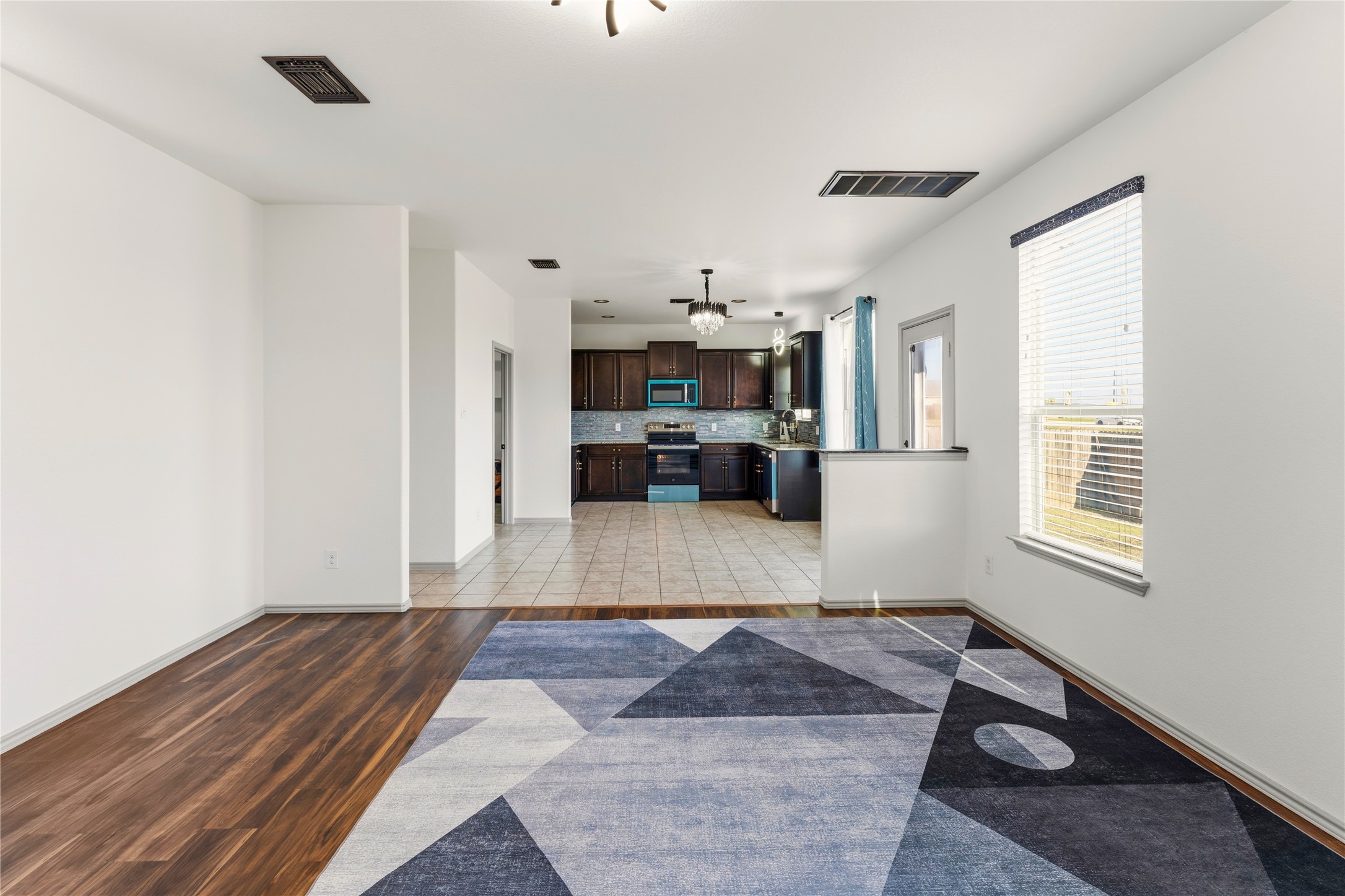 100 Serpentine Lane Jarrell, TX 76537 - Photo 8 of 40 a living room with furniture and a fireplace