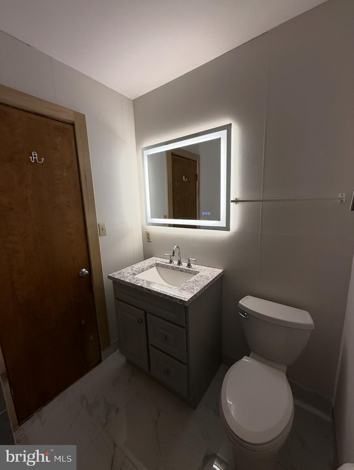 310 Brush Neck Road Susan, VA 23163 - Photo 66 of 70 a bathroom with a toilet sink and mirror