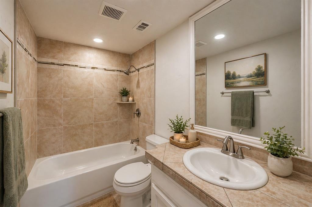 9999 Boat Club Road, Unit 311 Fort Worth, TX 76179 - Photo 13 of 25 a bathroom with a sink toilet tub and shower