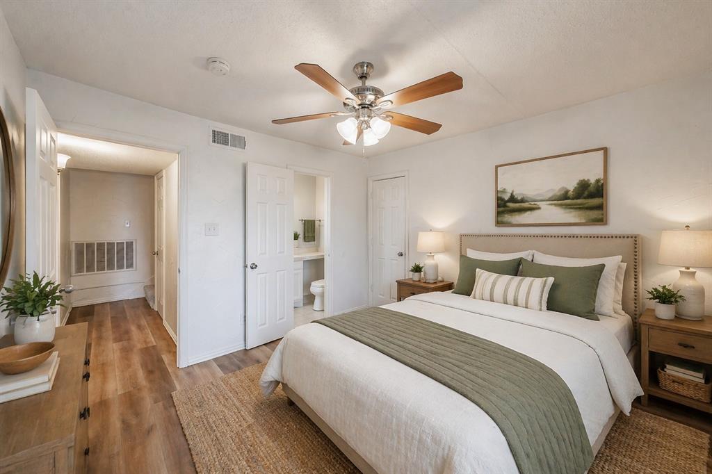 9999 Boat Club Road, Unit 311 Fort Worth, TX 76179 - Photo 14 of 25 a bedroom with a bed and a chandelier