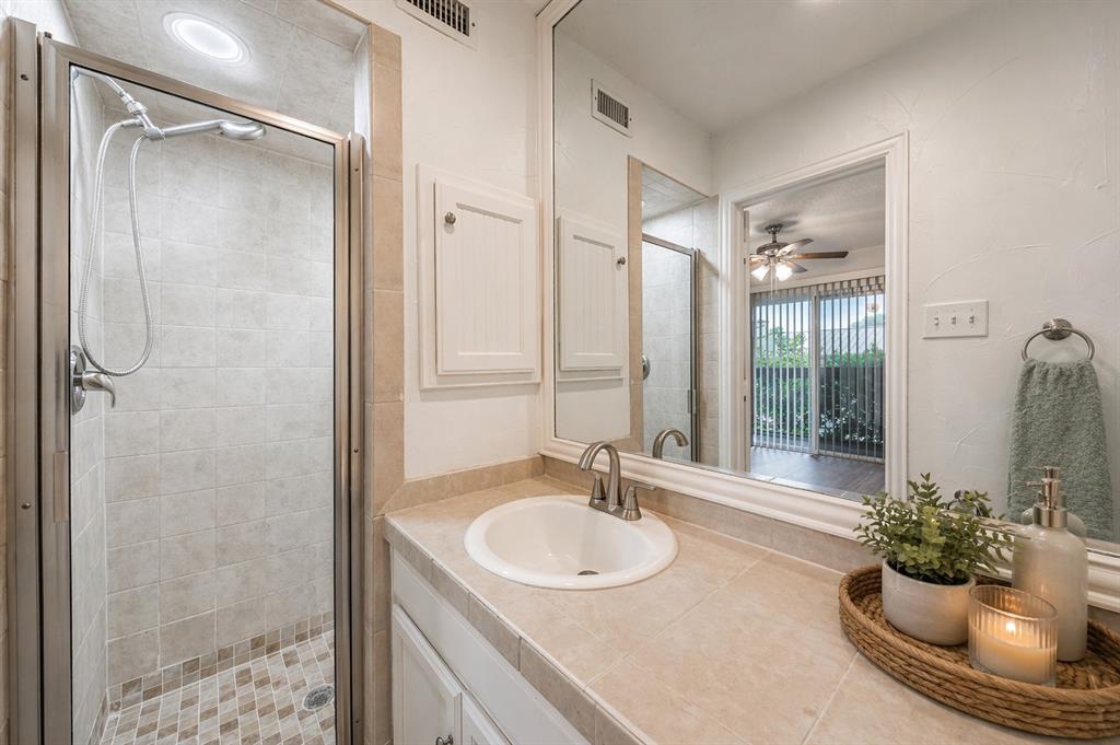 9999 Boat Club Road, Unit 311 Fort Worth, TX 76179 - Photo 15 of 25 a bathroom with a sink and a mirror