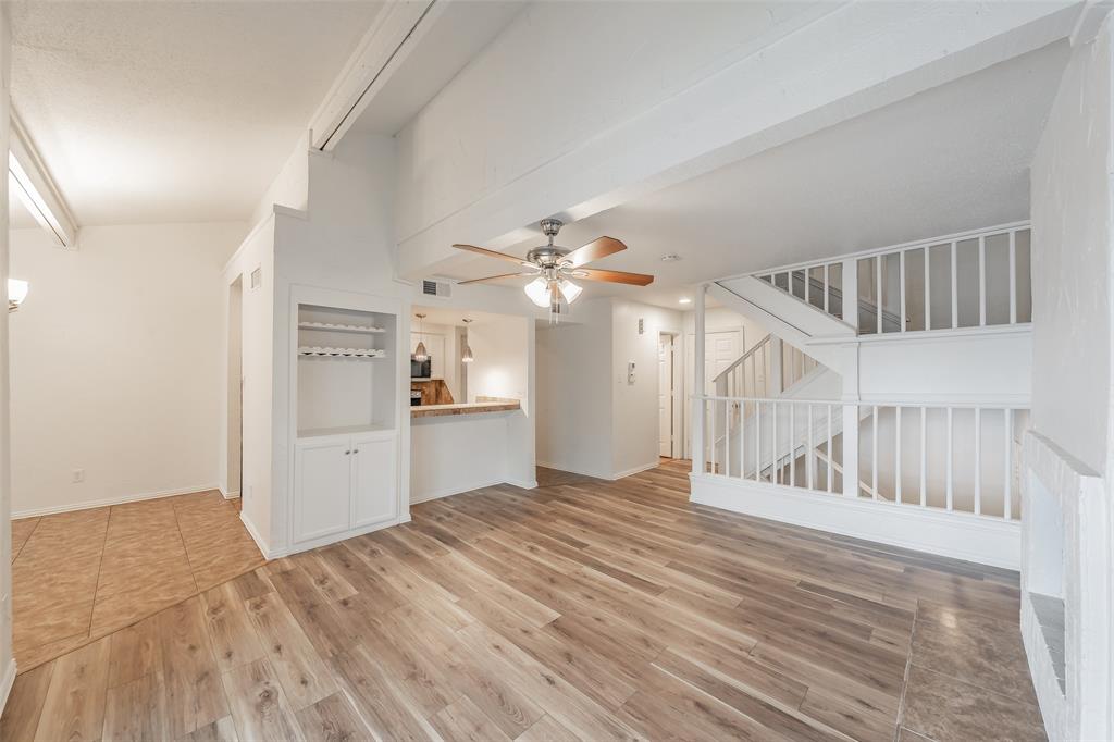 9999 Boat Club Road, Unit 311 Fort Worth, TX 76179 - Photo 19 of 25 a view of a kitchen with wooden floor and a ceiling fan