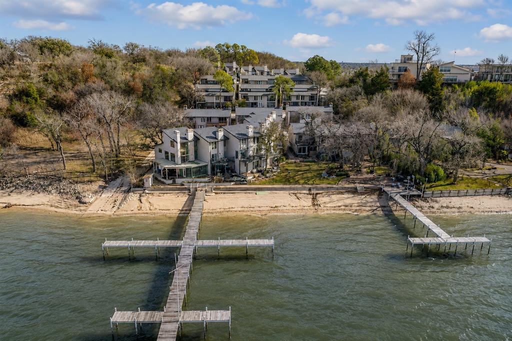 9999 Boat Club Road, Unit 311 Fort Worth, TX 76179 - Photo 2 of 25 a view of a lake with a yard