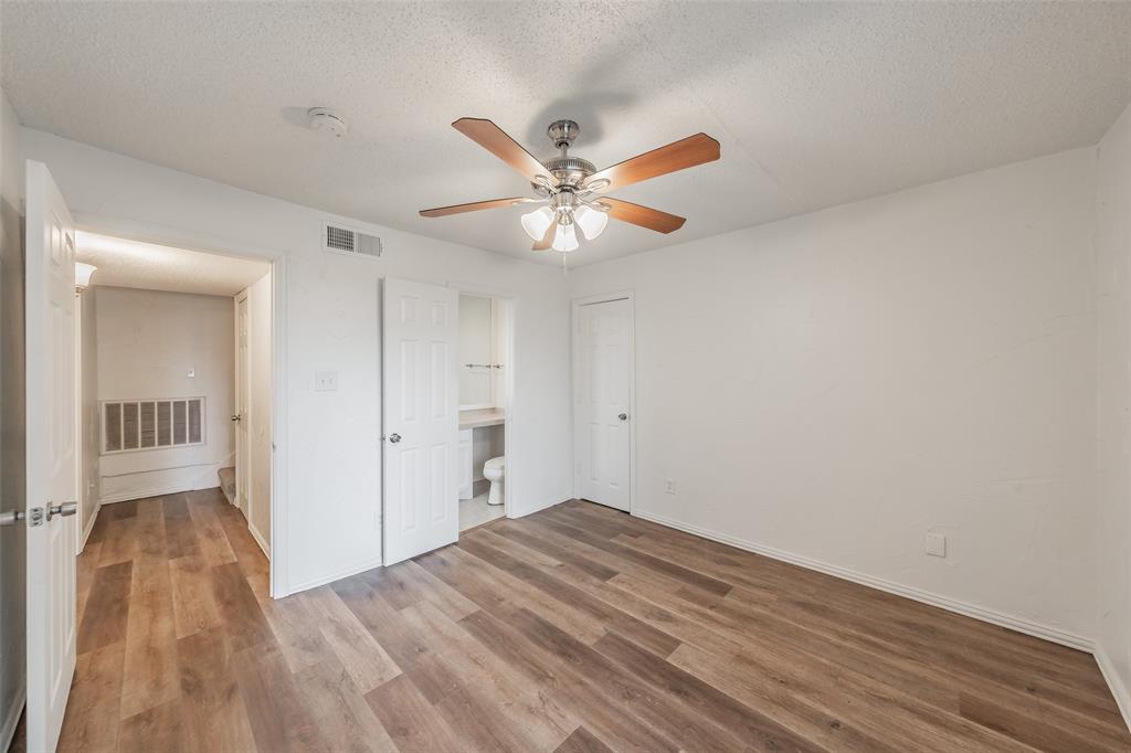 9999 Boat Club Road, Unit 311 Fort Worth, TX 76179 - Photo 25 of 25 a view of a big room with wooden floor and a chandelier fan