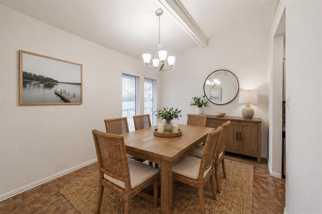 9999 Boat Club Road, Unit 311 Fort Worth, TX 76179 - Photo 5 of 25 a view of a dining room with furniture and chandelier