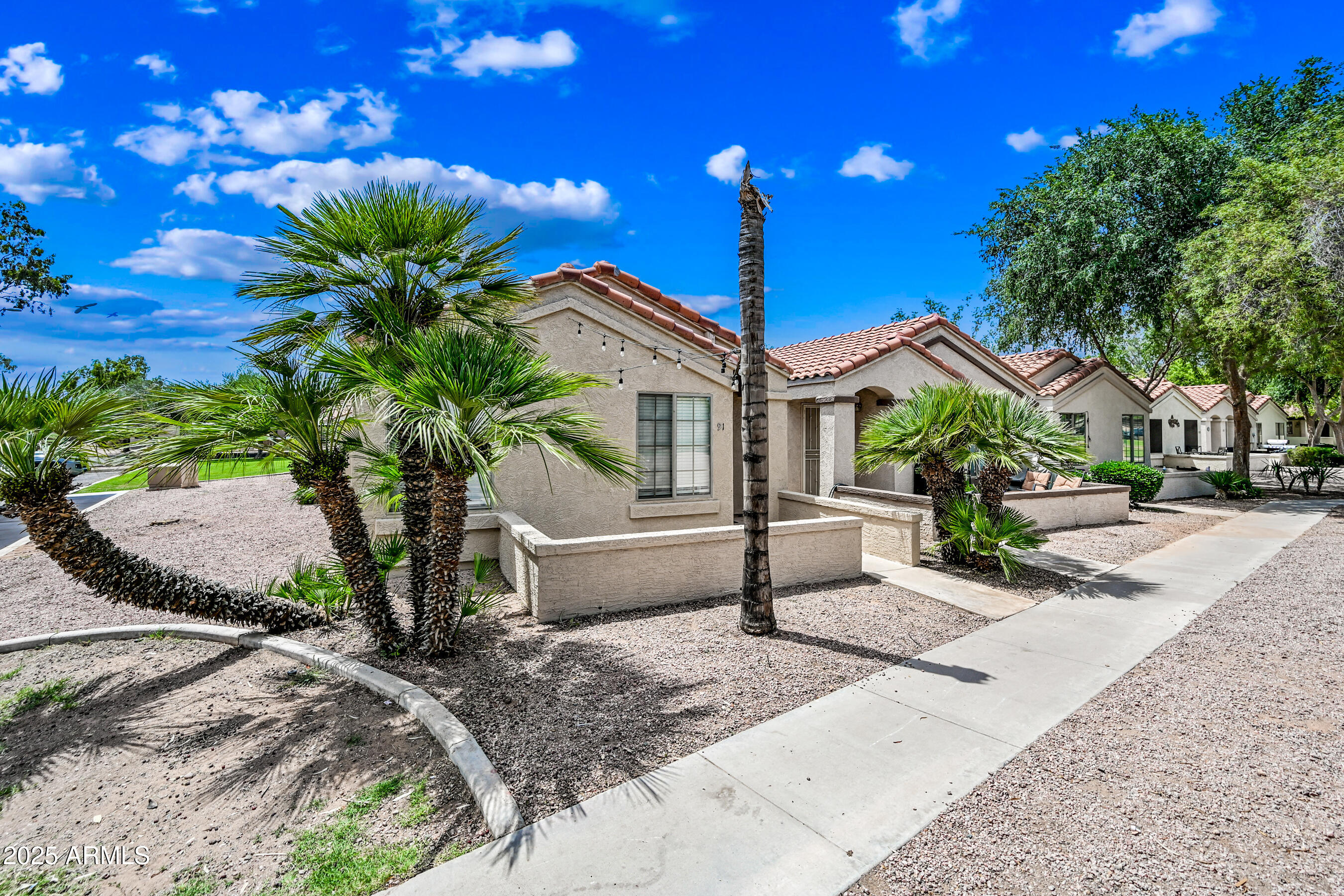 a house view with a garden space