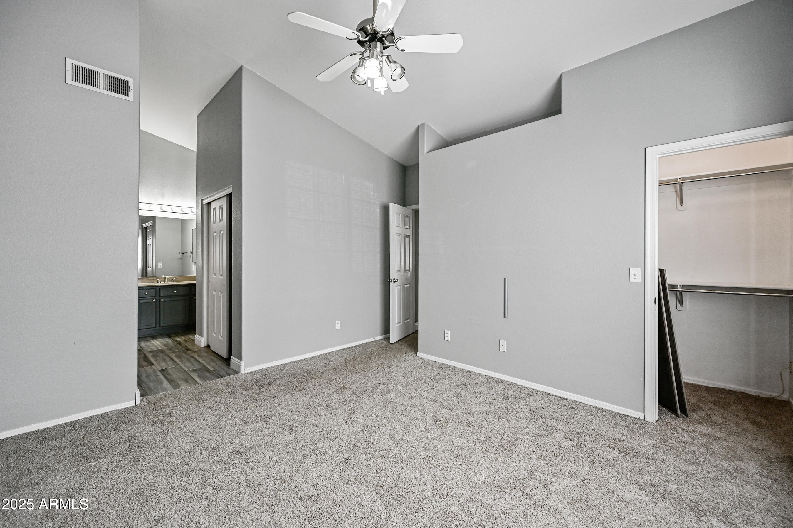726 South Nebraska Street, Unit 91 Chandler, AZ 85225 - Photo 14 of 20 an empty room with closet and a chandelier fan