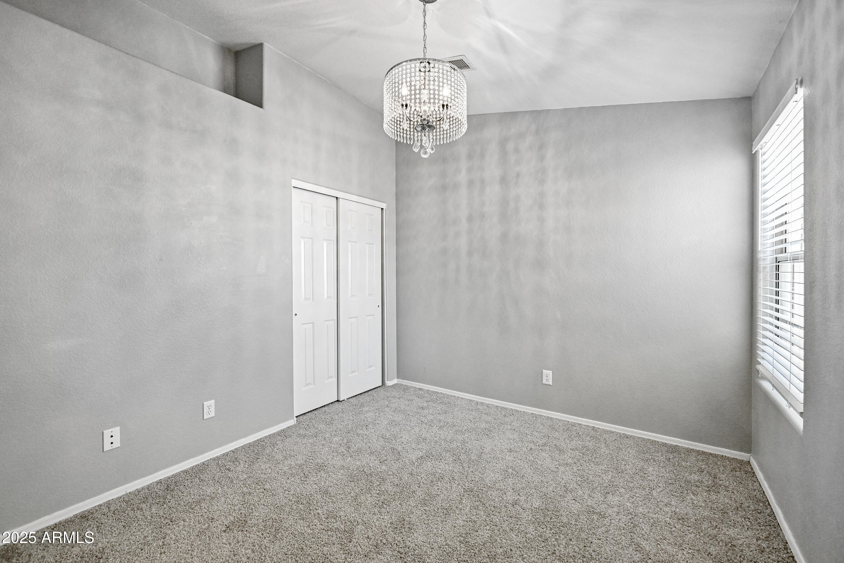 726 South Nebraska Street, Unit 91 Chandler, AZ 85225 - Photo 18 of 20 a view of a chandelier fan and window in a room
