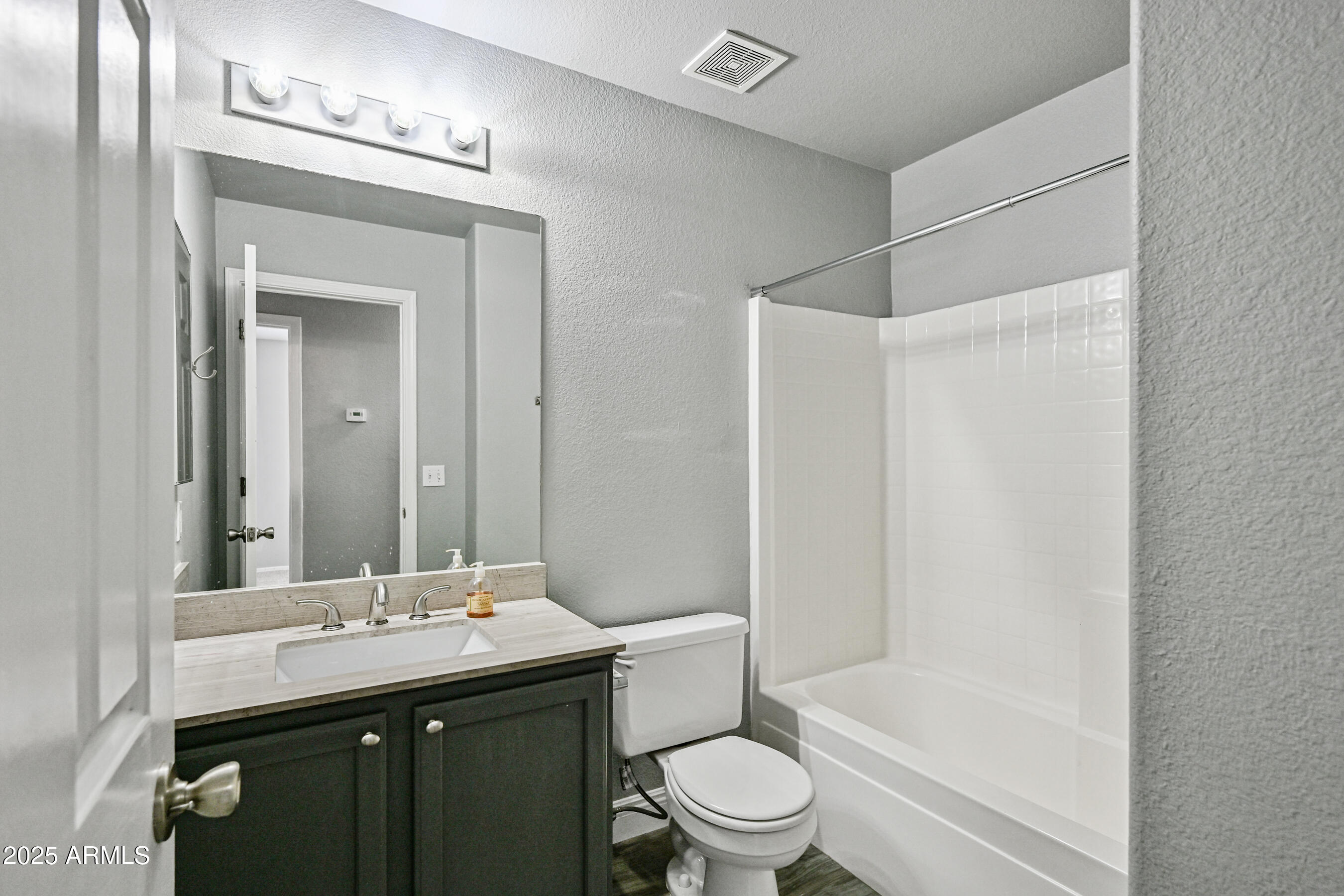 726 South Nebraska Street, Unit 91 Chandler, AZ 85225 - Photo 19 of 20 a bathroom with a sink a toilet and shower