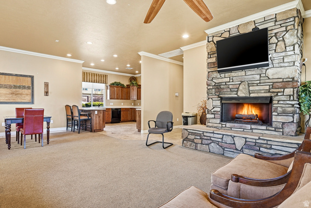 1177 Northfield Road, Unit 26 Cedar City, UT 84721 - Photo 38 of 45 Spacious living area featuring a floor-to-ceiling stone fireplace, recessed lighting, and crown molding