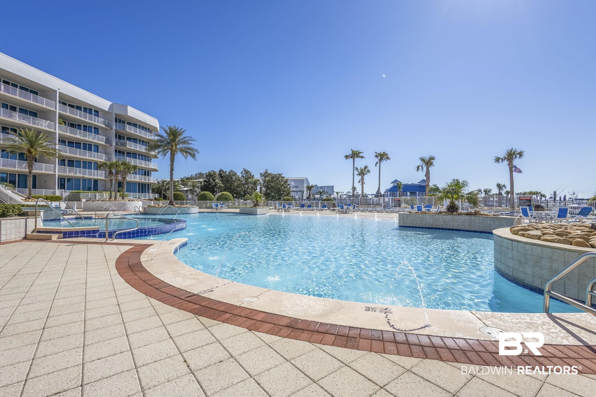 27800 Canal Road, Unit 313 Orange Beach, AL 36561 - Photo 18 of 23 Community pool with a patio area