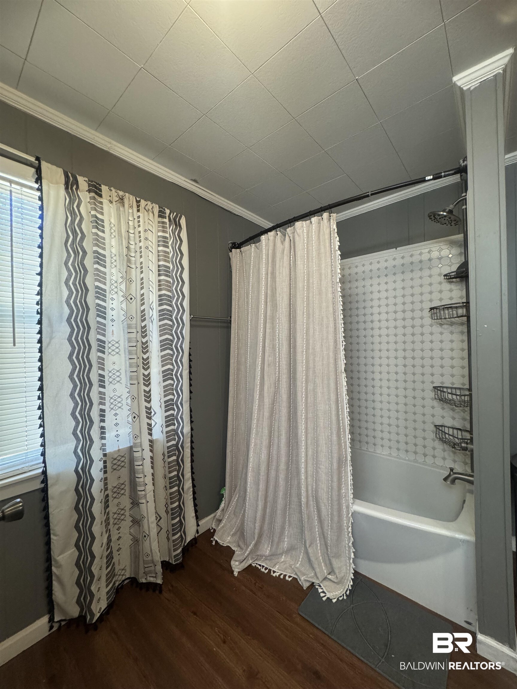 3097 Old Castleberry Road Brewton, AL 36426 - Photo 18 of 49 Bathroom with crown molding, shower / bath combo, and wood-type flooring