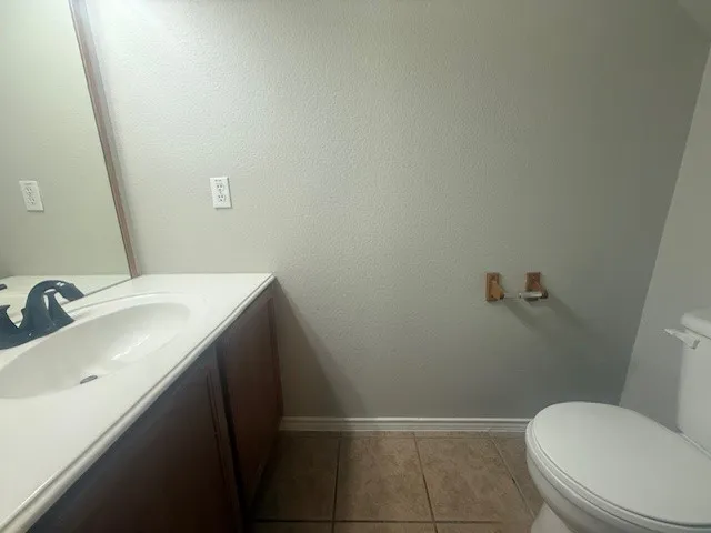 a bathroom with a sink and toilet