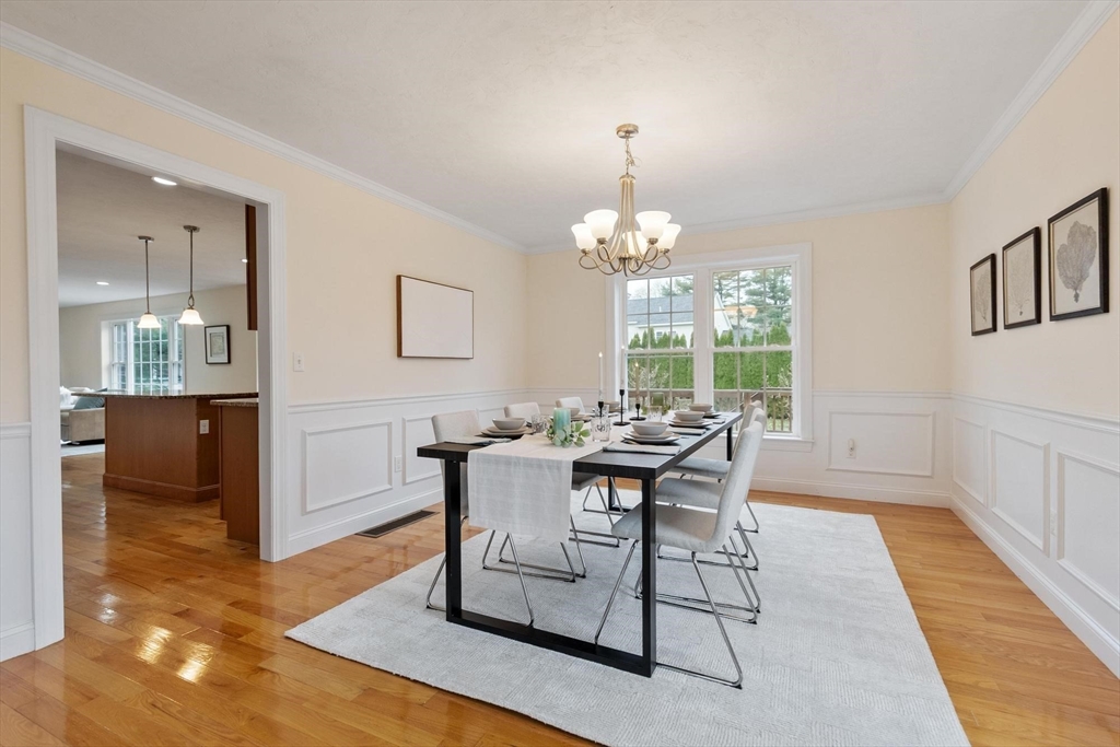 4 Henley Road Acton, MA 01720 - Photo 11 of 32 a view of a dining room with furniture and chandelier