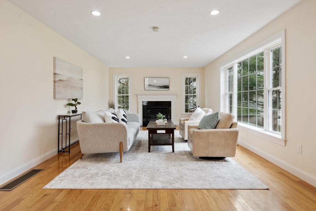 4 Henley Road Acton, MA 01720 - Photo 17 of 32 a living room with furniture and a fireplace