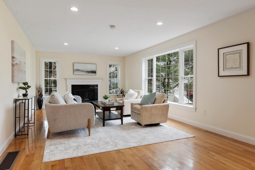 4 Henley Road Acton, MA 01720 - Photo 19 of 32 a living room with furniture and a fireplace