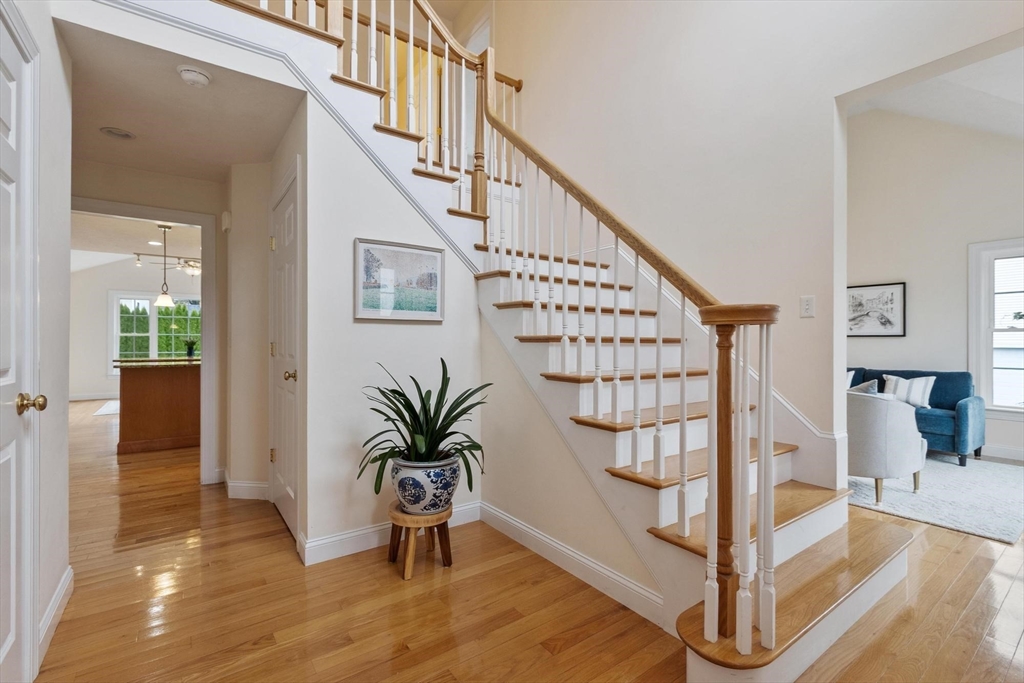 4 Henley Road Acton, MA 01720 - Photo 2 of 32 a view of entryway with wooden floor and stairs