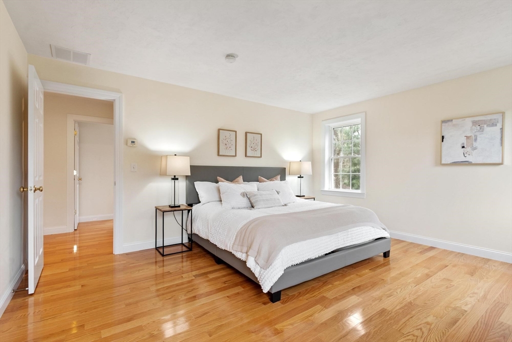4 Henley Road Acton, MA 01720 - Photo 22 of 32 a bedroom with a bed and a night stand