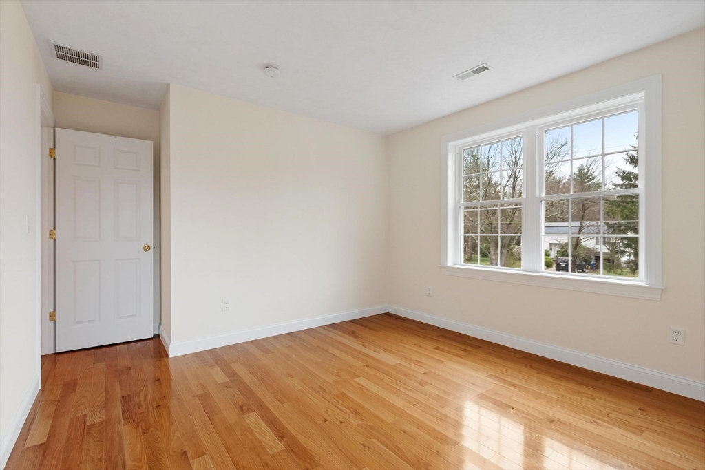 4 Henley Road Acton, MA 01720 - Photo 29 of 32 a view of empty room with wooden floor and fan