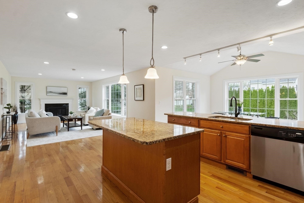 4 Henley Road Acton, MA 01720 - Photo 3 of 32 a dining hall with stainless steel appliances granite countertop a sink a window and chairs