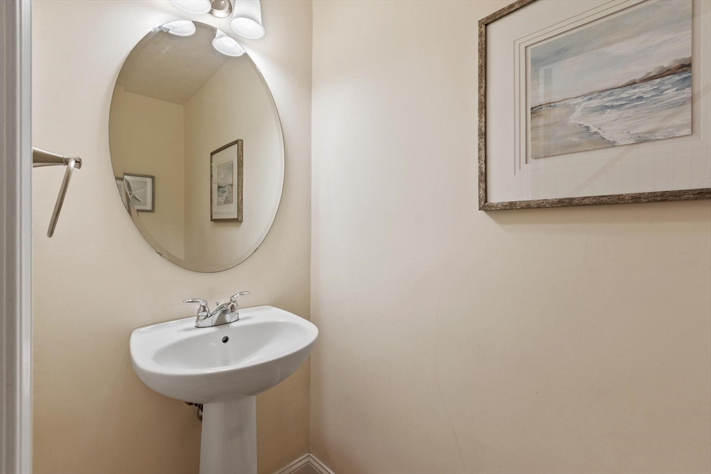 4 Henley Road Acton, MA 01720 - Photo 31 of 32 a bathroom with a sink and mirror