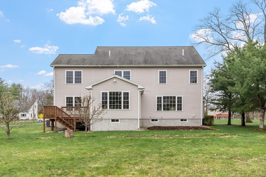 4 Henley Road Acton, MA 01720 - Photo 32 of 32 a front view of a house with a garden