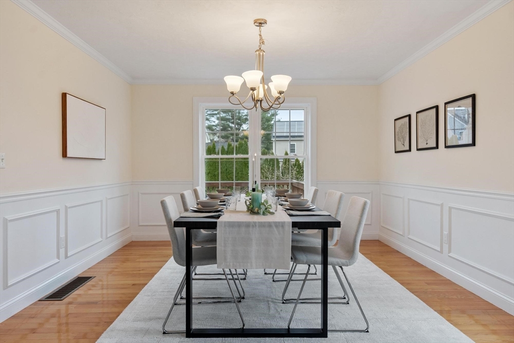 4 Henley Road Acton, MA 01720 - Photo 9 of 32 a dining room with furniture a rug and wooden floor