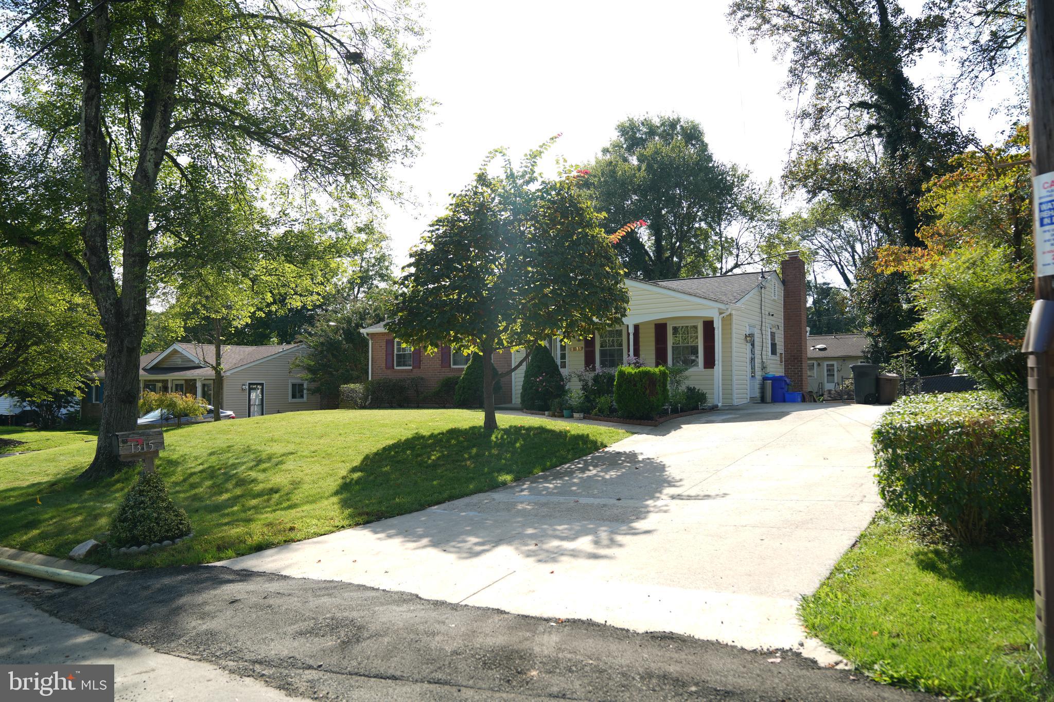1315 Gresham Road Silver Spring, MD 20904 - Photo 5 of 62 a front view of a house with a yard and trees