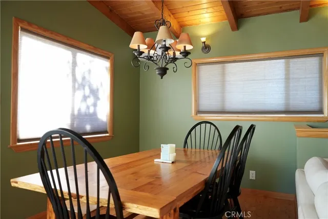 a view of a dining room with furniture and window
