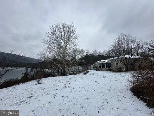 a view of a yard covered with snow