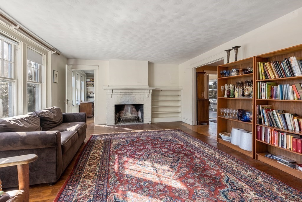 25 Francis Road Wellesley, MA 02482 - Photo 9 of 11 a living room with furniture and a book shelf
