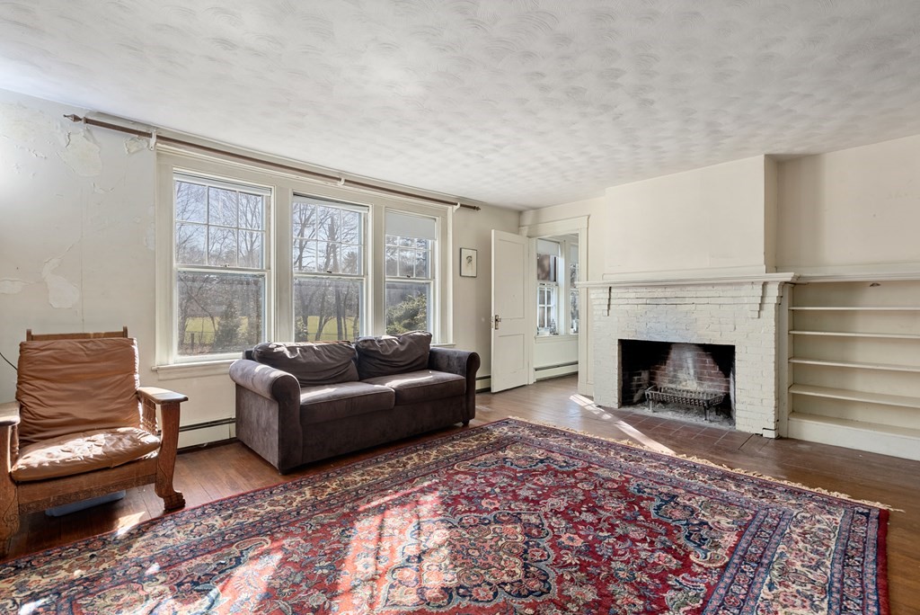 25 Francis Road Wellesley, MA 02482 - Photo 10 of 11 a living room with furniture and a fireplace