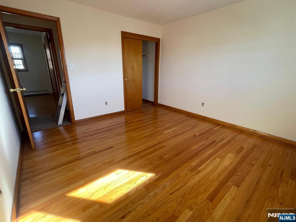 435 Taylor Avenue, Unit 2 South Hackensack, NJ 07606 - Photo 5 of 6 a view of empty room with wooden floor
