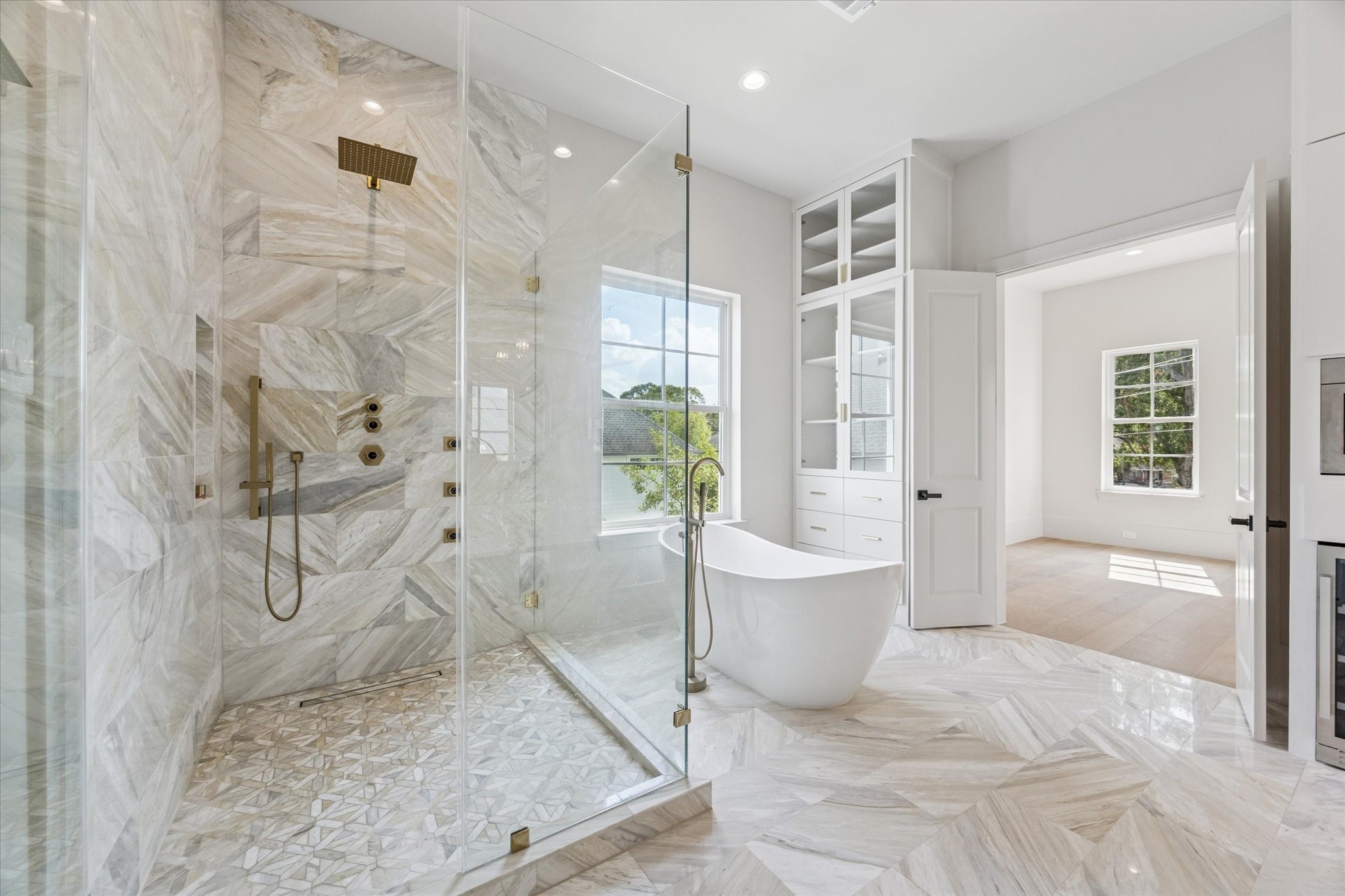 7203 Tickner Street Houston, TX 77055 - Photo 23 of 43 a spacious bathroom with a tub shower and window