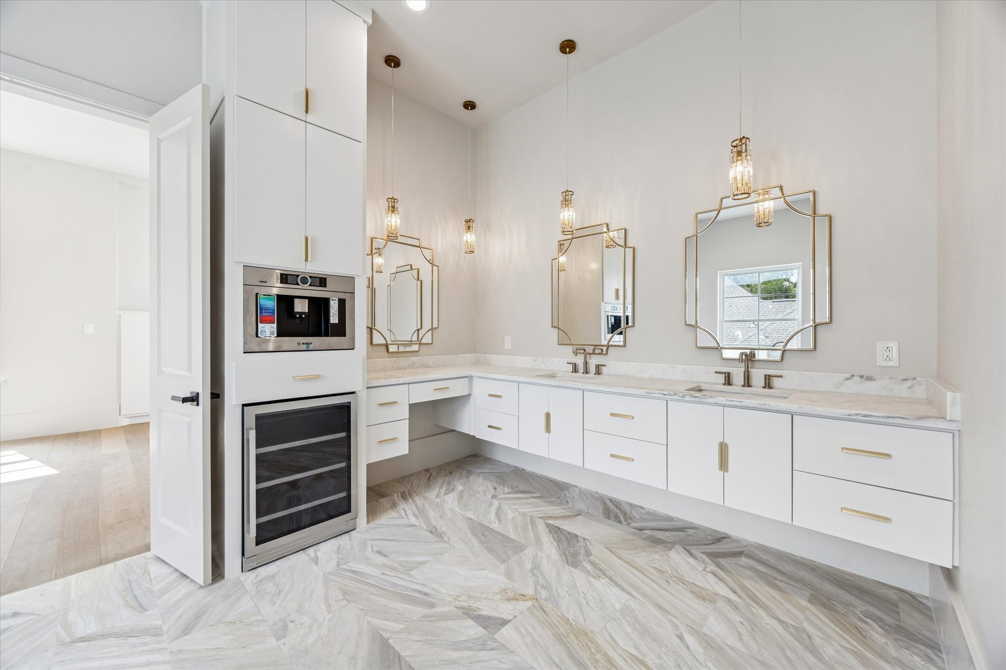 7203 Tickner Street Houston, TX 77055 - Photo 24 of 43 a large white bathroom with a double vanity sink a mirror and a