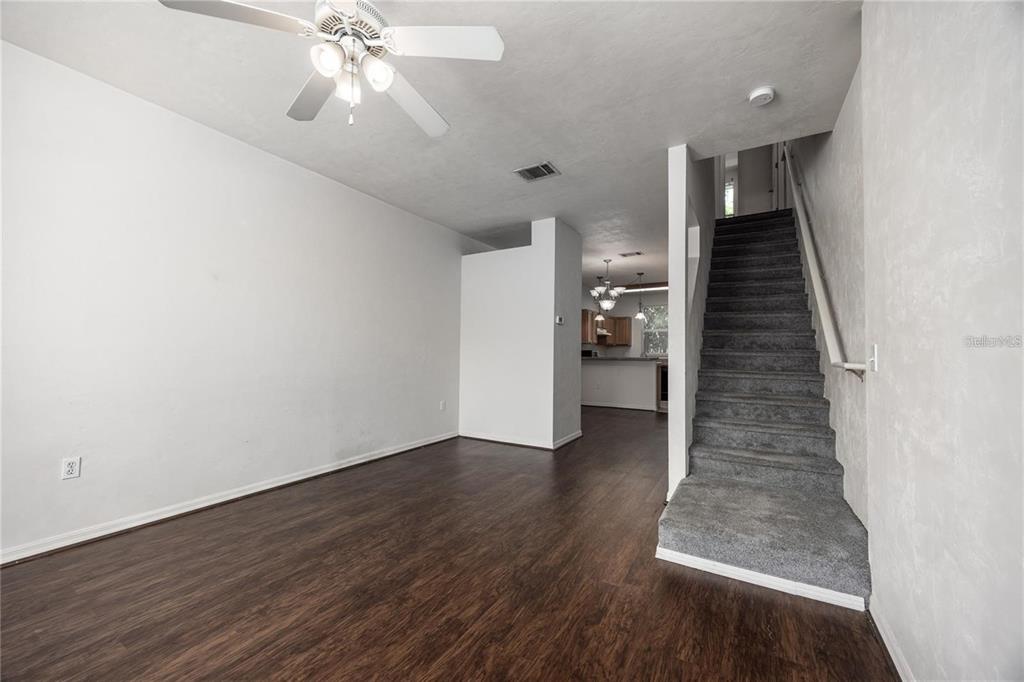 3510 Southwest 30th Way, Unit 158 Gainesville, FL 32608 - Photo 4 of 27 wooden floor in an empty room with a window