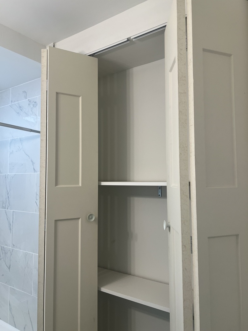 1921 North Pulaski Road, Unit 1 Chicago, IL 60639 - Photo 15 of 16 a view of walk in closet with empty racks